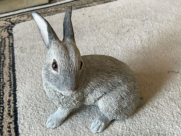 country artists fine figurines sculptures grey rabbit lying Image